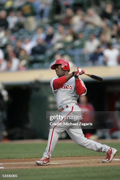 Jimmy Rollins of the Philadelphia Phillies hits during the game against the Oakland Athletics at McAfee Coliseum on June 17, 2005 in Oakland,...