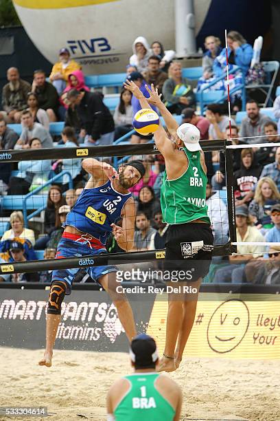 John Mayer of the USA hits the ball over the net against Saymon Barbosa of Brazil during the semi-final match during day 5 of the 2016 AVP Cincinnati...