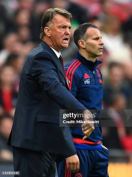 Louis van Gaal manager of Manchester United reacts as Ryan Giggs assistant manager of Manchester United looks on during The Emirates FA Cup Final...