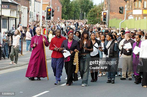 Liverpool, UNITED KINGDOM: Slain teenager Anthony Walker's mother, Gee Walker , leads 2,000 people in a walk in Huyton, Liverpool in memory of the...