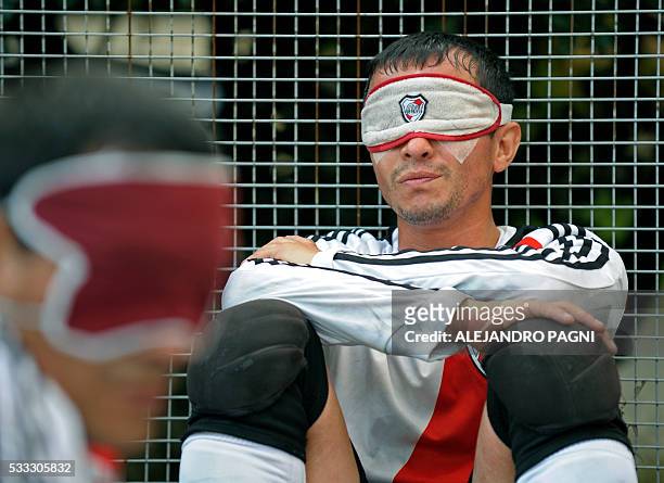 River Plate's Marcelo Panisa rests after the end of half time during a blind football match of the Argentine FaDeC championship in Buenos Aires on...