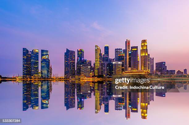 reflection of singapore business district - standing water stock pictures, royalty-free photos & images