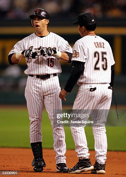 Carlos Beltran of the Houston Astros listens to Astros first base coach Jose Cruz in game five of National League Championship Series against the St....