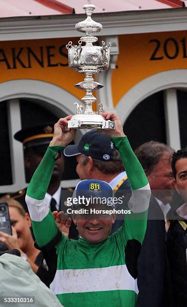 Trainer Keith Desormeaux raises the Woodlawn Vase after Exaggerator wins the Preakness Stakes, on May 21, 2016 at Pimlico Race Course, Baltimore.