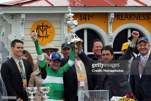 Jockey Kent and his brother trainer Keith Desormeaux raises the Woodlawn Vase after Exaggerator wins the Preakness Stakes, on May 21, 2016 at Pimlico...