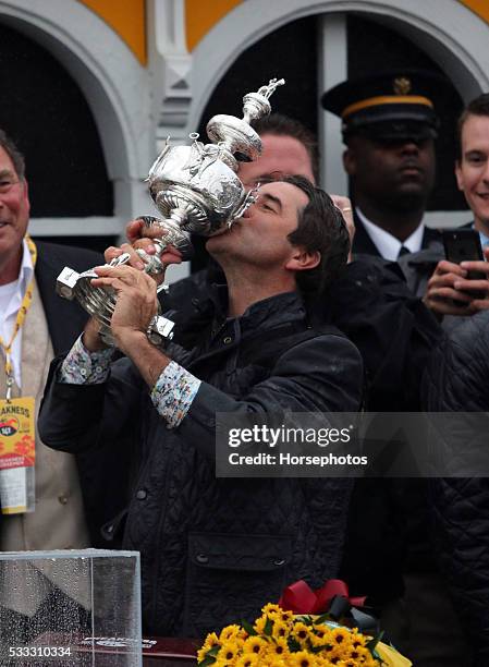 Trainer Keith Desormeaux raises the Woodlawn Vase after Exaggerator wins the Preakness Stakes, on May 21, 2016 at Pimlico Race Course, Baltimore.