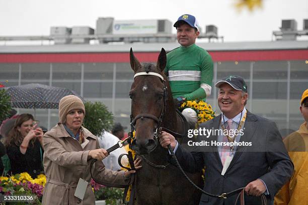 Jockey Kent Desormeaux raises the Woodlawn Vase after Exaggerator wins the Preakness Stakes, on May 21, 2016 at Pimlico Race Course, Baltimore.