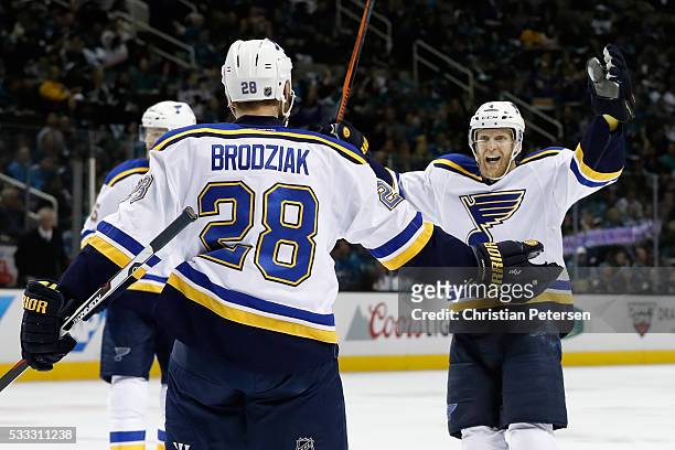 Kyle Brodziak of the St. Louis Blues celebrates with Carl Gunnarsson after his first goal in game four of the Western Conference Finals against the...