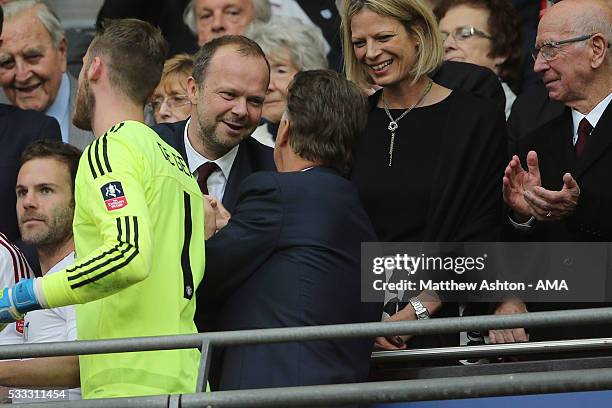 Ed Woodward the executive vice-chairman of Manchester United greets Louis van Gaal Manager / head coach of Manchester United and Ryan Giggs the...