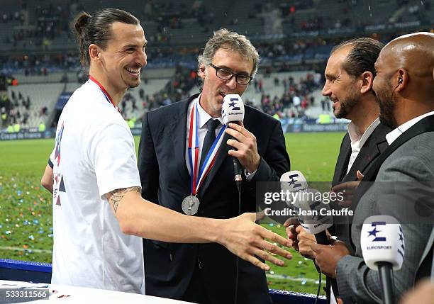 Zlatan Ibrahimovic and coach Laurent Blanc of PSG are interviewed by Lionel Charbonnier and Olivier Dacourt for Eurosport following the French Cup...