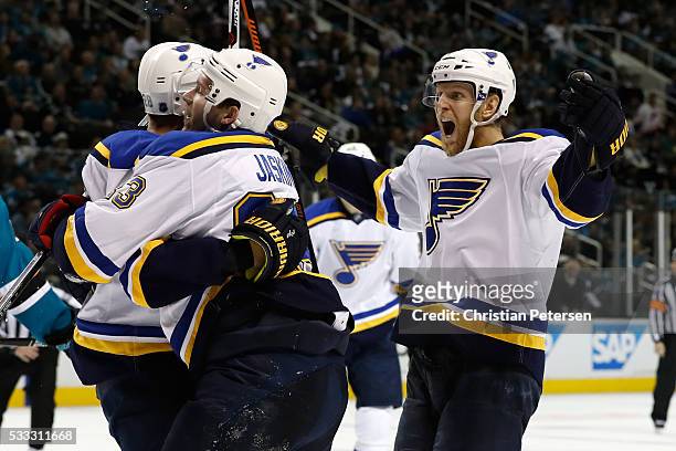Kyle Brodziak of the St. Louis Blues celebrates with Carl Gunnarsson and Dmitrij Jaskin after his second goal in game four of the Western Conference...