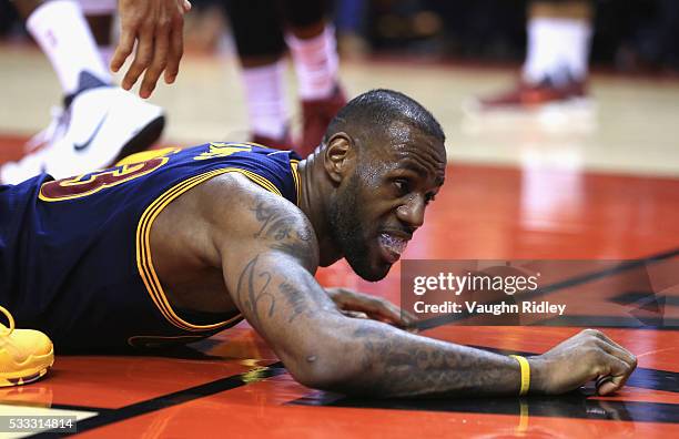 LeBron James of the Cleveland Cavaliers reacts after falling down during the first half against the Toronto Raptors in game three of the Eastern...