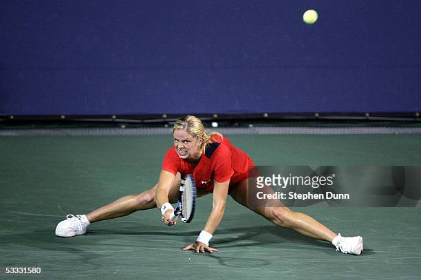 Kim Clijsters of Belgium hits a sliding forehand while playing against Shuai Peng of China during the quarterfinals of the Acura Classic at the La...