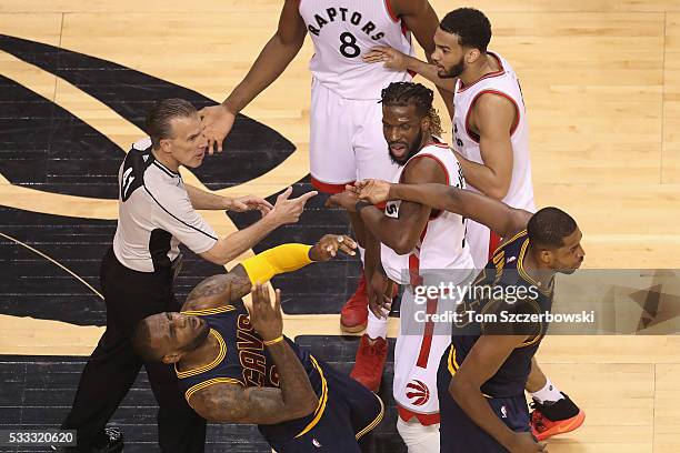 LeBron James of the Cleveland Cavaliers reacts after being hit in the face by teammate Tristan Thompson during the first half against the Toronto...