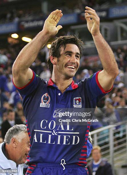 Andrew Johns of the Knights celebrates victory from the bench during the round 22 NRL match between the Bulldogs and the Newcastle Knights held at...