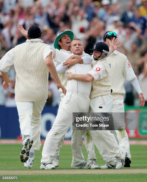 Andrew Flintoff is congratulated by team mates after taking the wicket of Ricky Ponting of Australia during day three of the Second npower Ashes Test...