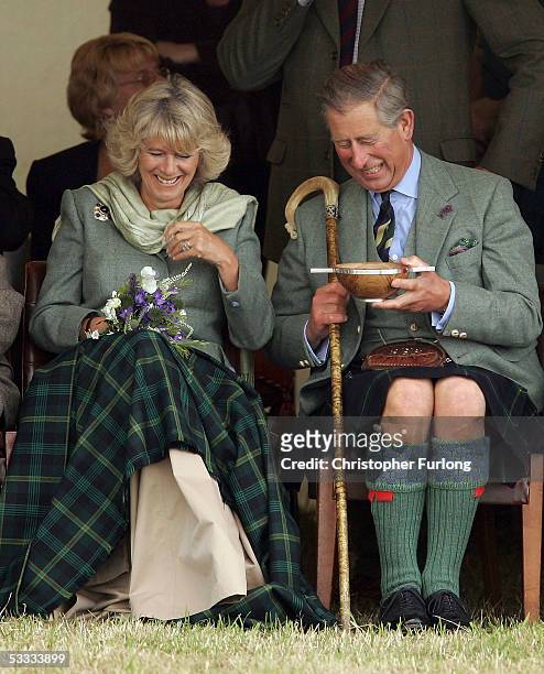 Prince Charles, the Prince of Wales, and his wife Camilla, the Duchess of Cornwall, in their role as the Duke and Duchess of Rothesay, drink whisky...