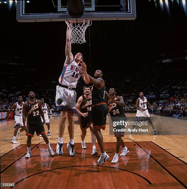 Pau Gasol of the Memphis Grizzlies dunking the ball over Rashard Lewis during the Pre-Season Game against the Seattle SuperSonics at The Pyramid in...