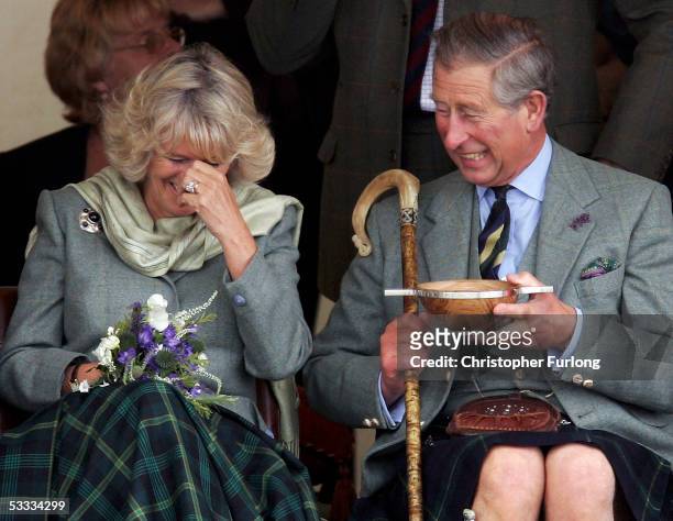 Prince Charles, the Prince of Wales, and his wife Camilla, the Duchess of Cornwall, in their role as the Duke and Duchess of Rothesay, drink whisky...