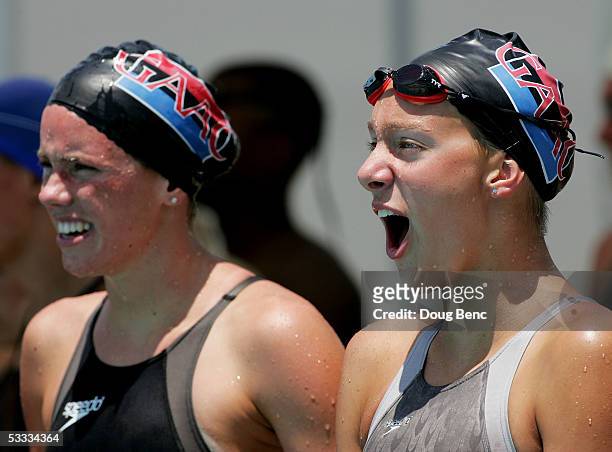Katherine Riefenstahl and Alicia Aemisegger of Germantown Academy Aquatic cheer on a teammate in heat 5 during the Women's 4X100 Meter Relay during...
