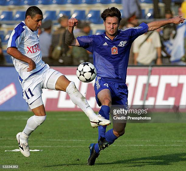 Fernandes de Silva Derley of Dinamo Moscow challenges Milan Leshiak of Saturn Ramenskoe during the Russian Premier League match August 6, 2005 in...