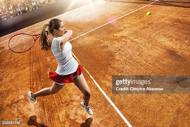female tennis player in action - wimbledon tennis stock pictures, royalty-free photos & images