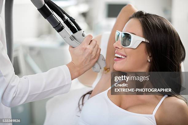 woman on epilation treatment - elektrolyse stockfoto's en -beelden