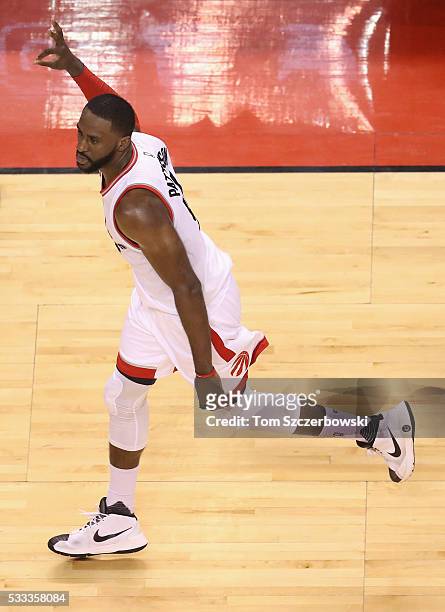 Patrick Patterson of the Toronto Raptors celebrates after making a three point basket during the second half against the Cleveland Cavaliers in game...