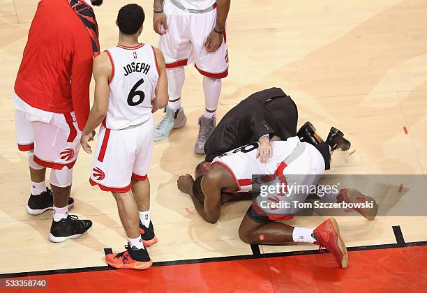 Bismack Biyombo of the Toronto Raptors reacts on the floor after the 4th quarter against the Cleveland Cavaliers in game three of the Eastern...