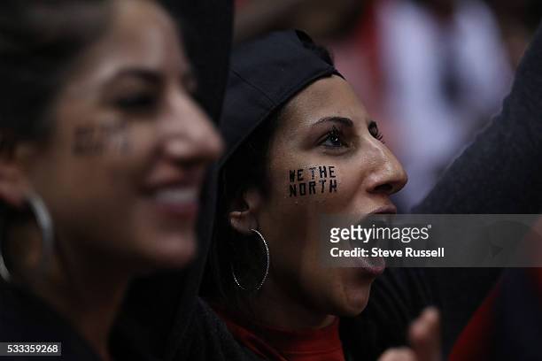 Fans celebrate as the Toronto Raptors beat the Cleveland Cavaliers in game 3 of the NBA Conference Finals at the Air Canada Centre in Toronto. May...