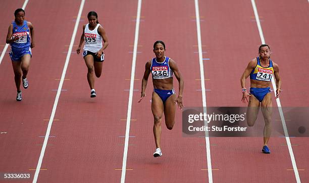 Tit Linda Sou of Cambodia, Pauline Kwalea of Solomon Islands Christine Arron of France and Zhanna Block of Ukraine compete during the heats of the...