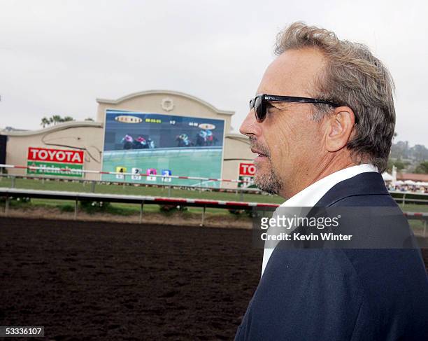 Actor Kevin Costner watches a race at the premiere of "Laffit: All About Winning", a documentary celebrating the life and career of horseracing's...
