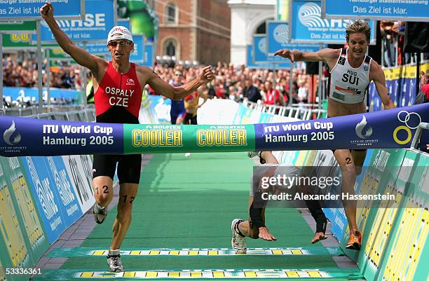 Filip Ospaly of Czech Republik wins in front of 2nd finisher Reto Hug and Sven Riederer of Switzerland in 3rd place at the Holsten City Man Elite...