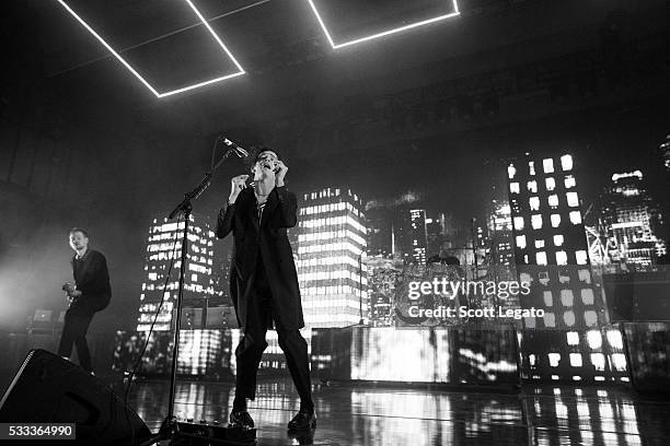 Adam Hann, Matthew Healy, George Daniel and Ross MacDonald of The 1975 perform on May 21, 2016 in Rochester Hills, Michigan.