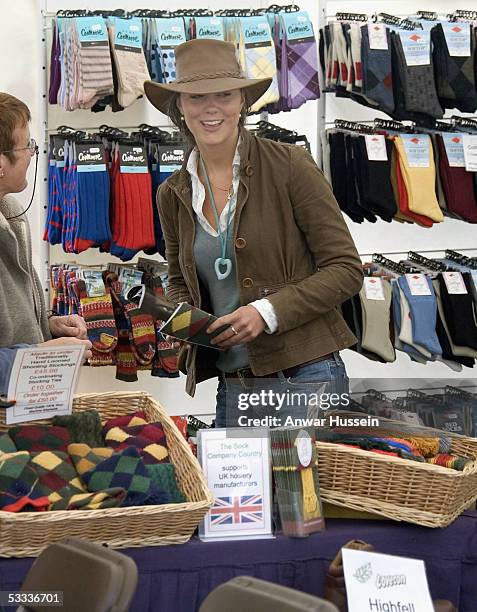 Kate Middleton, girlfriend of Prince William, does some shopping for socks when she attends the second day of the Gatcombe Park Festival of British...