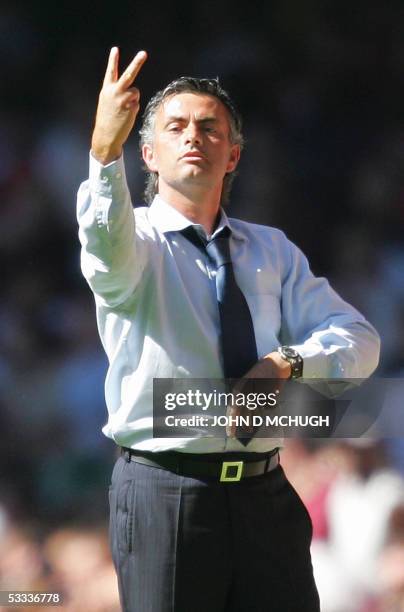 Cardiff, UNITED KINGDOM: Chelsea's manager Jose Mourinho gestures to his team during the FA Community Shield between Chelsea and Arsenal at the...