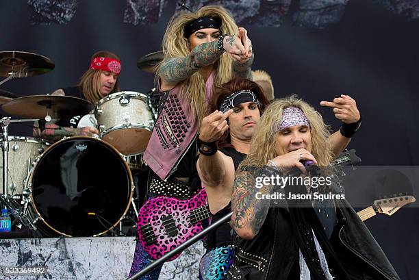 Musicians Michael Starr, Satchel, Lexxi Foxx of Steel Panther perform at MAPFRE Stadium on May 21, 2016 in Columbus, Ohio.