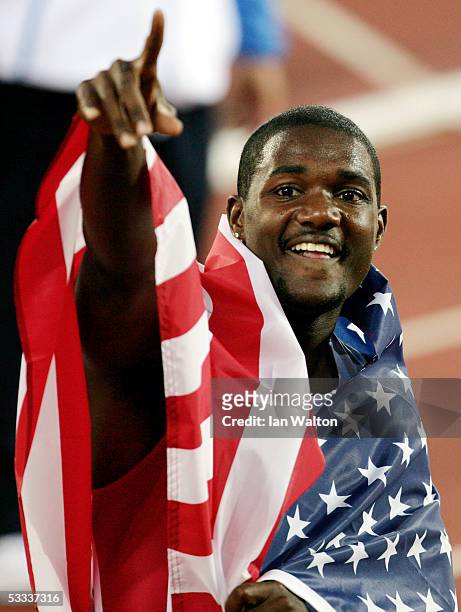 Justin Gatlin of USA celebrates after he won gold in the men's 100 Metres final at the 10th IAAF World Athletics Championships on August 7, 2005 in...
