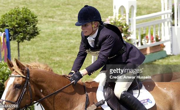 Zara Phillips, daughter of Princess Anne, competes in the showjumping section on the third day of the Gatcombe Park Festival of British Eventing at...