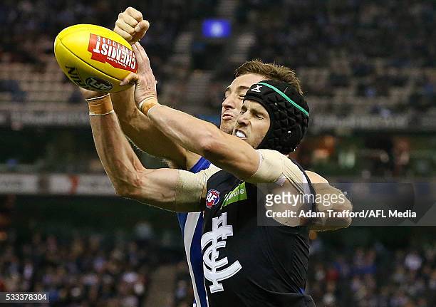 Marc Murphy of the Blues and Shaun Atley of the Kangaroos compete for the ball during the 2016 AFL Round 09 match between the North Melbourne...