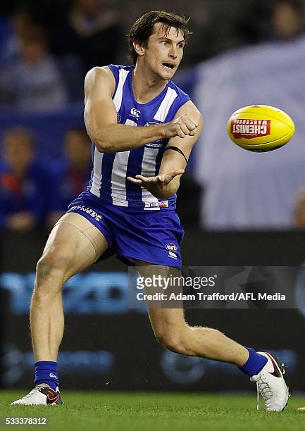 Farren Ray of the Kangaroos handpasses the ball in his first game for the Kangaroos during the 2016 AFL Round 09 match between the North Melbourne...