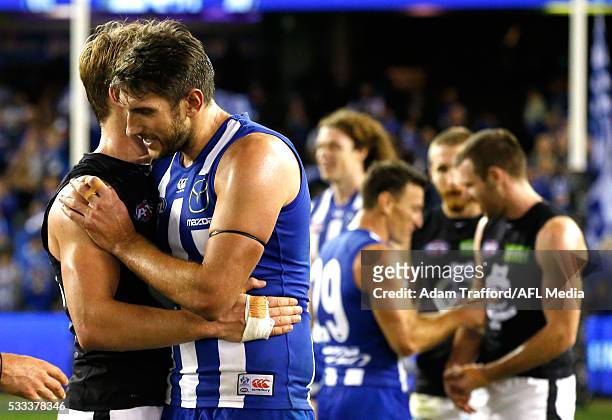 Jarrad Waite of the Kangaroos hugs former teammate Ciaran Byrne of the Blues during the 2016 AFL Round 09 match between the North Melbourne Kangaroos...