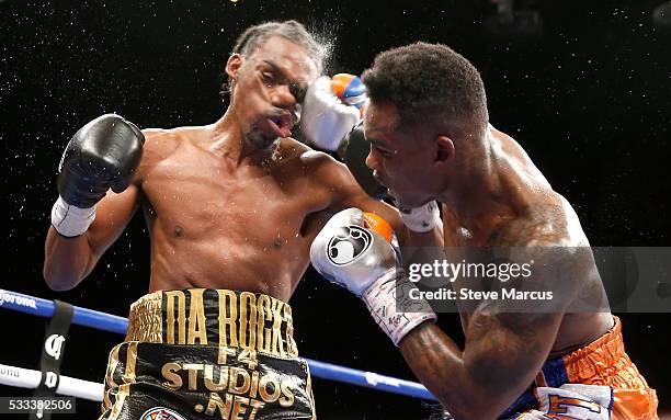 Super welterweight boxer Jermell Charlo connects with a punch on John Jackson during the eighth round of their fight for a vacant WBC title at The...