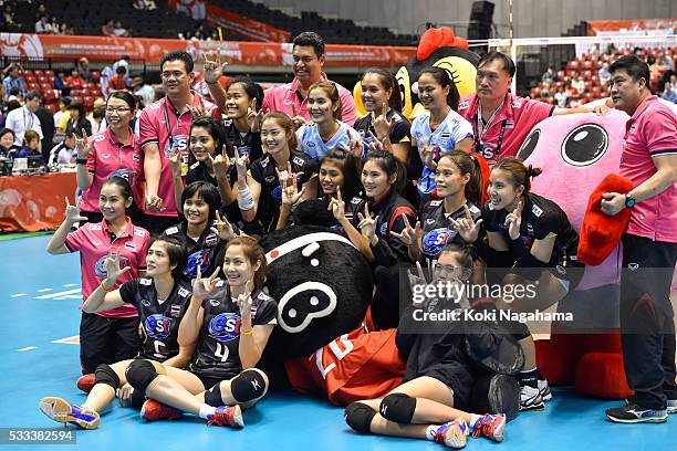 Players of Thailand pose for photographs after winning the Women's World Olympic Qualification game between Thailand and Peru at Tokyo Metropolitan...