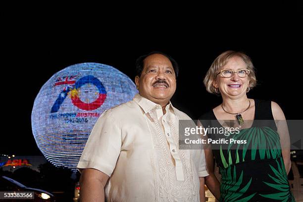 Ambassador Amanda Gorely and National Historical Commission of the Philippines Executive Director Vic Badoy pose in front of the electronic globe...