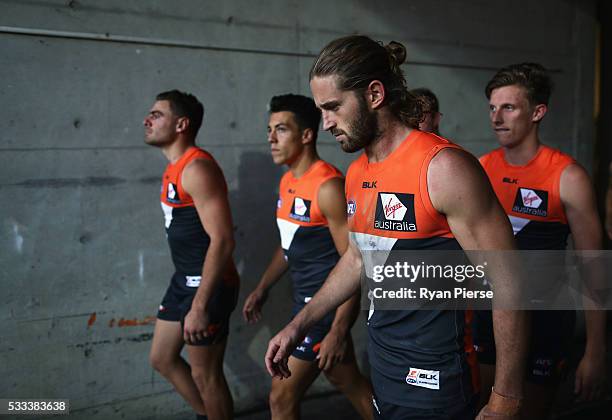 Stephen Coniglio, Dylan Shiel, Callan Ward and Lachie Whitfield of the Giants lead their team out during the round nine AFL match between the Greater...