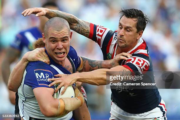 David Klemmer of the Bulldogs is tackled during the round 11 NRL match between the Canterbury Bulldogs and the Sydney Roosters at ANZ Stadium on May...