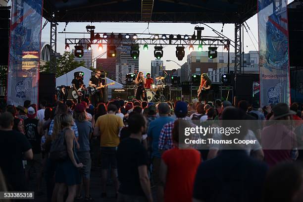 Best Coast Lead singer Bethany Cosentino and band members play under the backdrop of Downtown Denver at the Project Pabst Denver event on May 21,...
