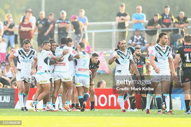 Nathan Davis of the Titans celebrates with his team mates after scoring a try during the round 11 NRL match between the Penrith Panthers and the Gold...