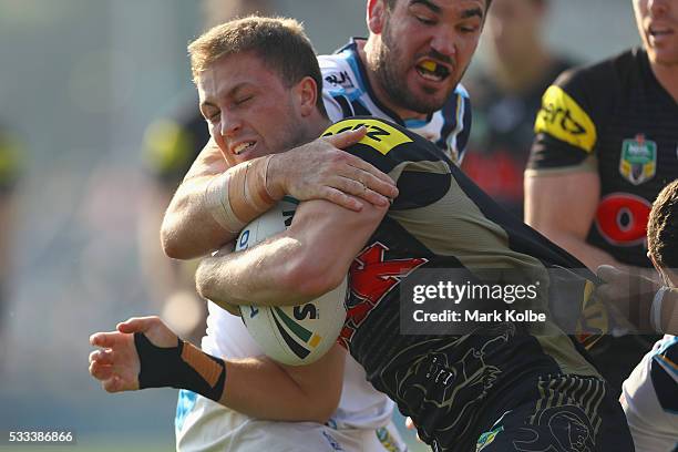 Matt Moylan of the Panthers is tackled during the round 11 NRL match between the Penrith Panthers and the Gold Coast Titans at Pepper Stadium on May...